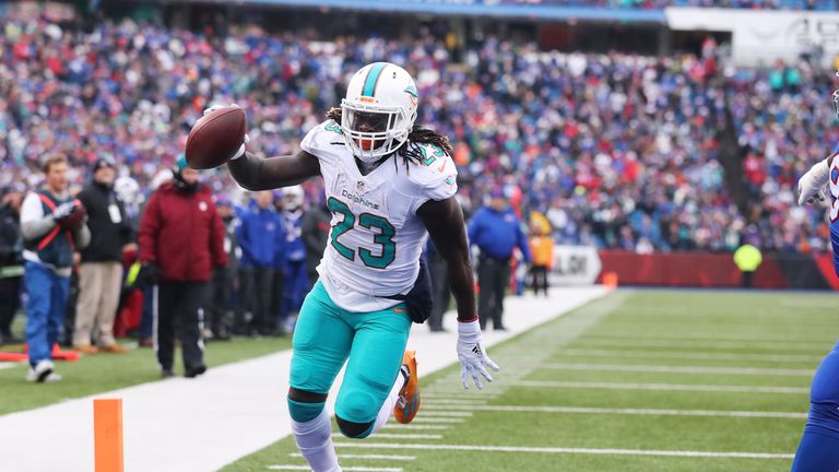 ORCHARD PARK, NY - DECEMBER 24:    Jay Ajayi #23 of the Miami Dolphins scores a touchdown against the Buffalo Bills during the first half at New Era Stadiu