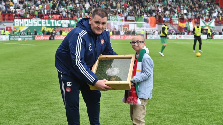 Hamilton coach George Cairns presents Jay Beatty with his goal of the season award