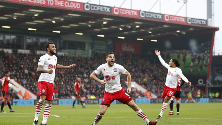 Southampton's English striker Jay Rodriguez (C) celebrates scoring his team's second goal with Southampton's English defender Ryan Bertrand (L)