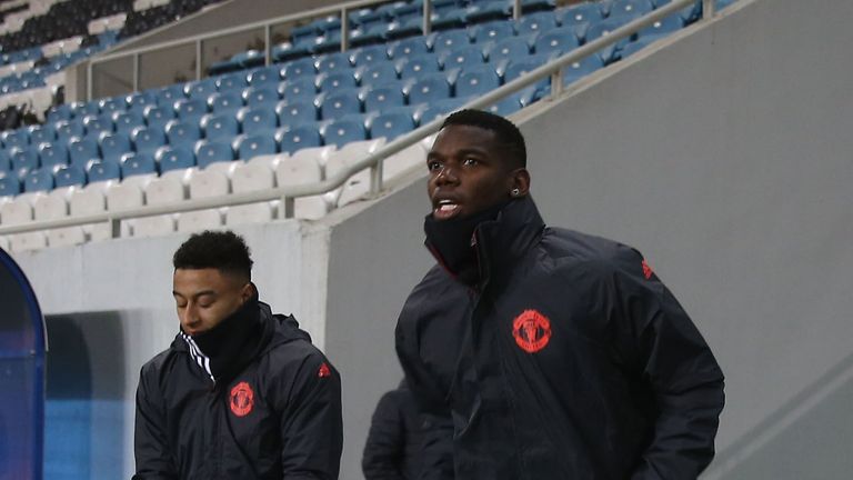Jesse Lingard and Paul Pogba trot out on to the Chornomorets Stadium pitch for Wednesday's training session