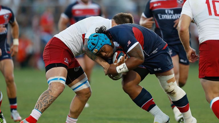 SACRAMENTO, CA - JUNE 25: Joe Taufete'e of the United States is tackled by Viktor Gresev of Russia in the second half of the match at Bonney Field on June 