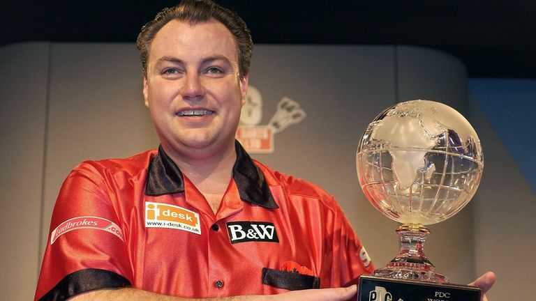 John Part with the PDC World Championship trophy after defeating Phil Taylor