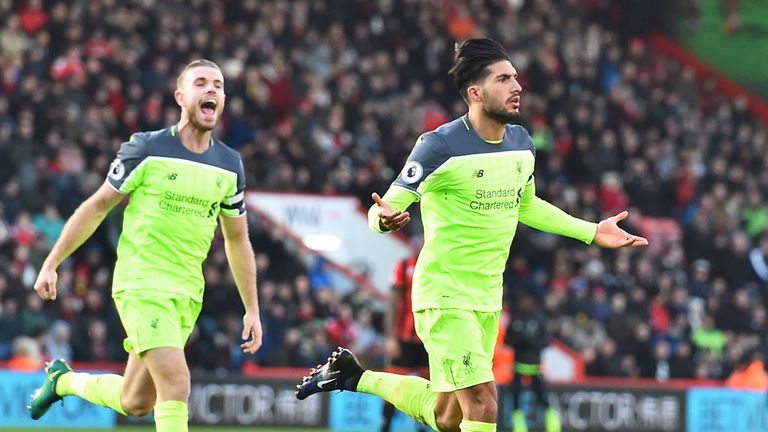 Jordanh Henderson runs to celebrate with Emre Can after his goal at Bournemouth