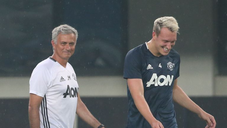 Manager Jose Mourinho and Phil Jones of Manchester United