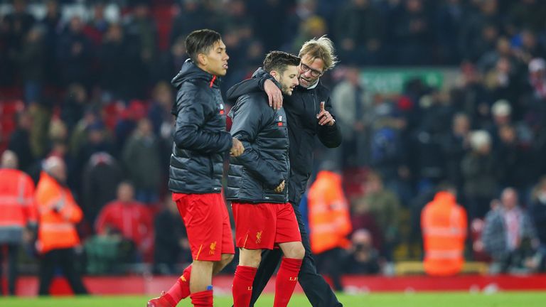 Jurgen Klopp in discussion with Adam Lallana after the 4-1 defeat of Stoke