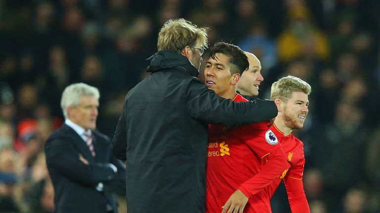 Jurgen Klopp embraces Roberto Firmino as he's substituted in the second half at Anfield