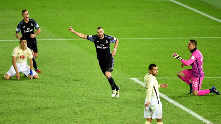 Real Madrid's forward Karim Benzema (C) reacts after scoring a goal during the Club World Cup semi-final football match between Club America of Mexico and 