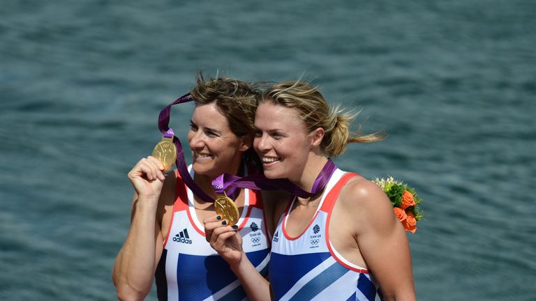 Great Britain's Anna Watkins (R) and Katherine Grainger pose on the podium after receiving their gold medals for the women's double sculls final A of the r