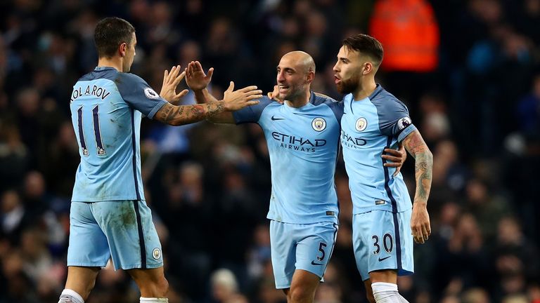 MANCHESTER, ENGLAND - DECEMBER 14: Pablo Zabaleta of Manchester City (C) celebrates scoring his sides first goal with Aleksander Kolorov of Manchester City