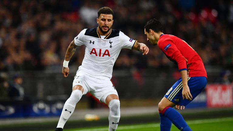 Kyle Walker of Tottenham Hotspur (L) attempts to take the ball past Georgi Milanov of CSKA Moscow
