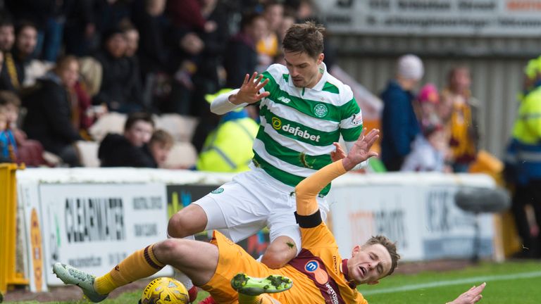 Celtic's Mikael Lustig tangles with Ross MacLean