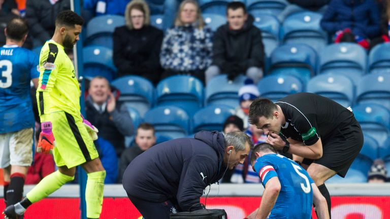 Lee Wallace receives treatment towards the end of the game