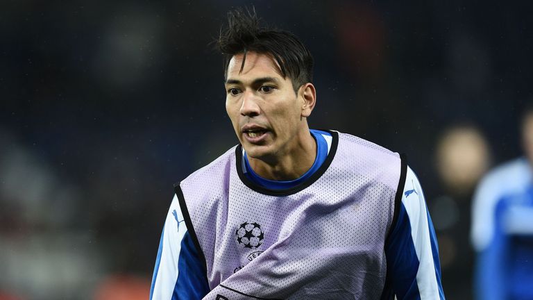Leicester City's Argentinian striker Leonardo Ulloa wears an anti-racism bib as he warms up ahead of the UEFA Champions League group G football match betwe