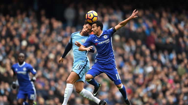 MANCHESTER, ENGLAND - DECEMBER 03:  Leroy Sane of Manchester City and Pedro of Chelsea compete for the ball during the Premier League match between Manches