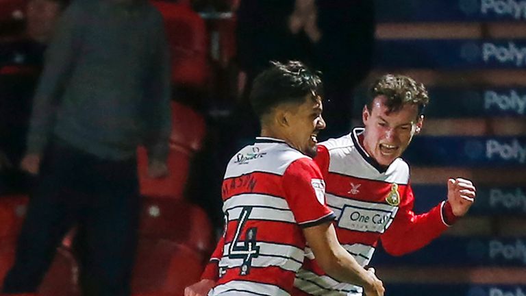 Doncaster Rovers' Liam Mandeville (right) celebrates scoring his side's first goal with team mate Niall Mason during the first round match of the Sky Bet E