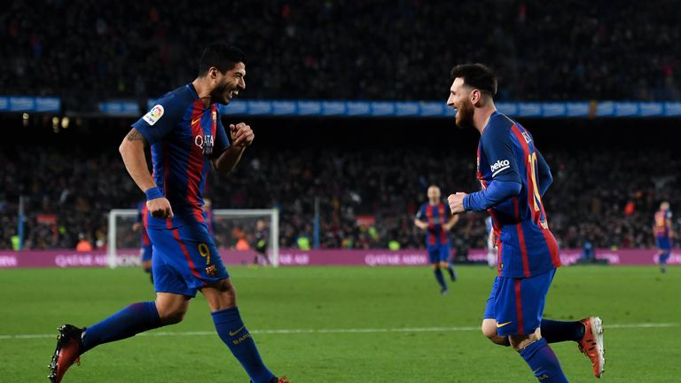 BARCELONA, SPAIN - DECEMBER 18:  Lionel Messi of FC Barcelona celebrates with his team mate Luis Suarez after scoring his team's fourth goal during the La 