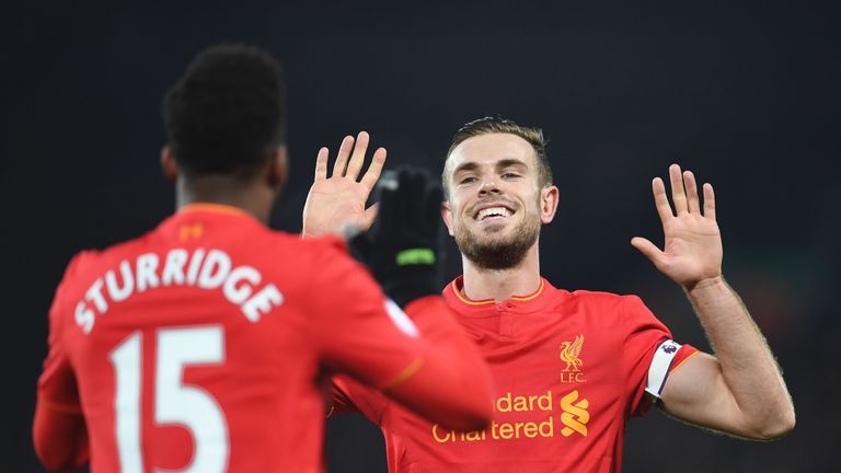 Daniel Sturridge celebrates with Jordan Henderson after extending Liverpool's lead over Stoke