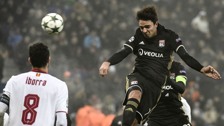 Lyon's French midfielder Clement Grenier (C) heads the ball during the UEFA Champions League Group H football match between Olympique Lyonnais (OL) and FC 