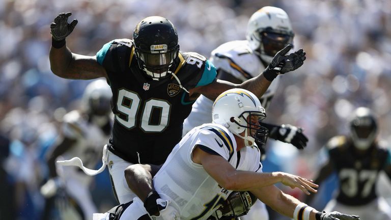 SAN DIEGO, CA - SEPTEMBER 18:  Malik Jackson #90 and  Dante Fowler #56 of the Jacksonville Jaguars bring down Philip Rivers #17 of the San Diego Chargers a