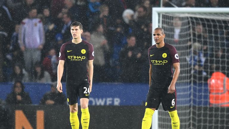 LEICESTER, ENGLAND - DECEMBER 10:  John Stones of Manchester City (L) and Fernando of Manchester City (R) are dejected after his side concede a goal during