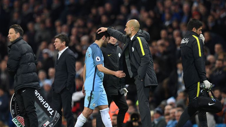 Manchester City manager Pep Guardiola consoles Ilkay Gundogan 
