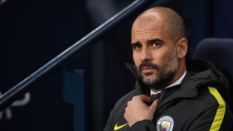 Pep Guardiola takes his seat on the home team bench prior to kick off