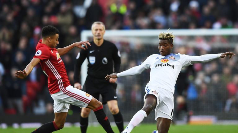 MANCHESTER, ENGLAND - DECEMBER 26:  Jesse Lingard of Manchester United and Dider Ndong of Sunderland compete for the ball during the Premier League match b