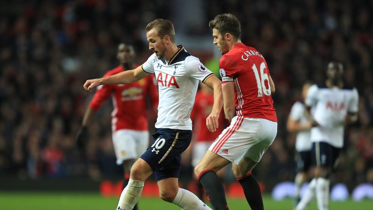 MANCHESTER, ENGLAND - DECEMBER 11: Harry Kane of Tottenham Hotspur and Michael Carrick of Manchester United compete for the ball during the Premier League 