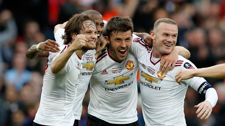 Manchester United's Dutch midfielder Daley Blind (L), Manchester United's English midfielder Ashley Young (2nd L), Manchester United's English midfielder M