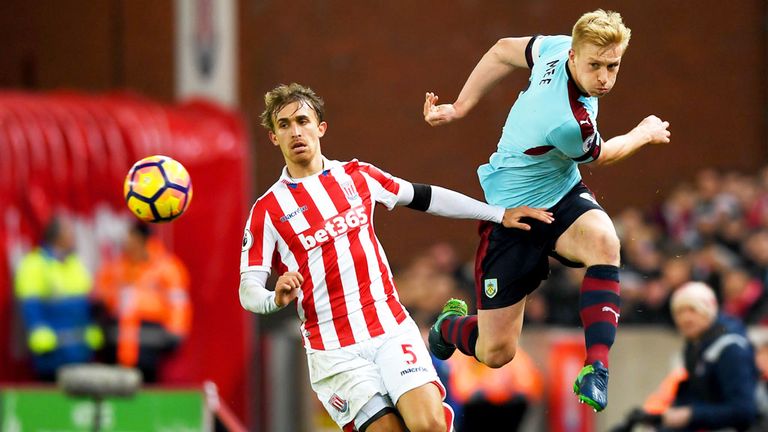 Stoke defender Marc Muniesa and Ben Mee of Burnley challenge for the ball