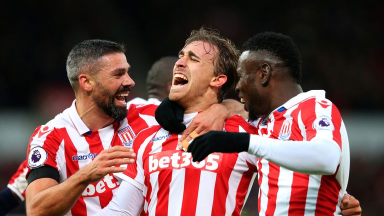 STOKE ON TRENT, ENGLAND - DECEMBER 03:  Marc Muniesa (C) of Stoke City celebrates scoring his team's second goal with his team mates during the Premier Lea