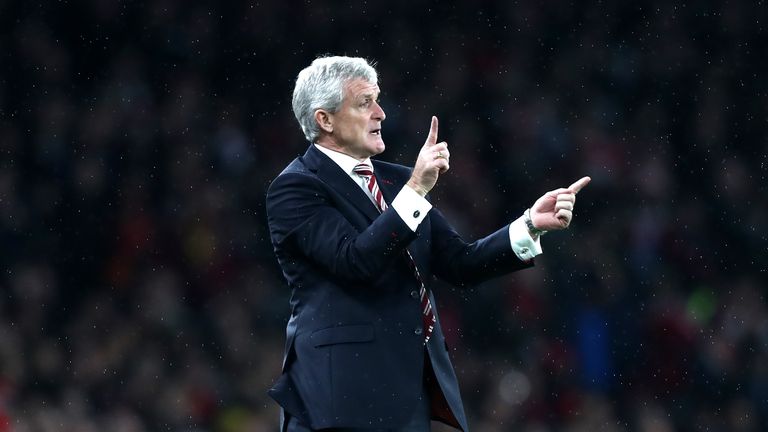 LONDON, ENGLAND - DECEMBER 10: Mark Hughes, Manager of Stoke City gives his team instructions during the Premier League match between Arsenal and Stoke Cit