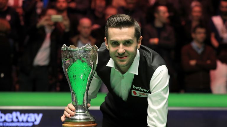 Mark Selby celebrates with the Betway UK Championship trophy