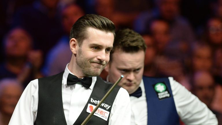 Mark Selby (left) studies table in his semi final match against Shaun Murphy during day eleven of the Betway UK Championships 2016, at the York Barbican.