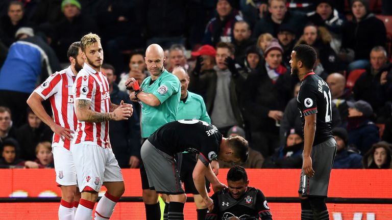 Marko Arnautovic receives a red card from referee Anthony Taylor