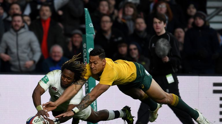 Marland Yarde  (L) scores for England despite the attentions of Israel Folau  (R) 
