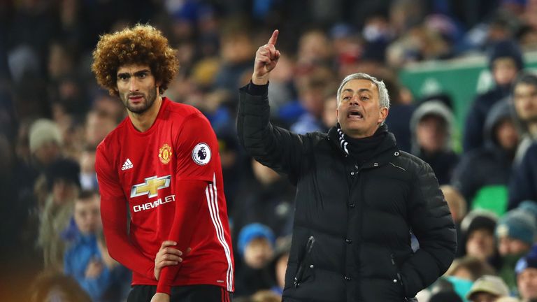 LIVERPOOL, ENGLAND - DECEMBER 04:  Jose Mourinho manager of Manchester United stands alongside substitute Marouane Fellaini of Manchester United 