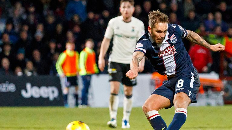 Ross County's Martin Woods fires home the third goal for the home side against Inverness