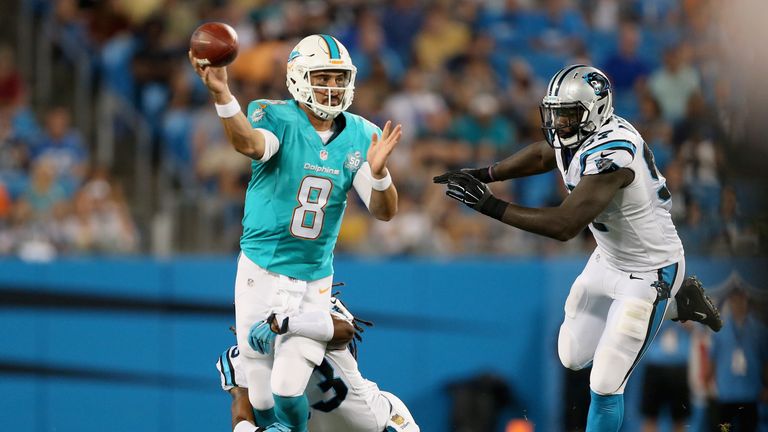 CHARLOTTE, NC - AUGUST 22:   Matt Moore #8 of the Miami Dolphins tries to pass against the Carolina Panthers during their game at Bank of America Stadium o