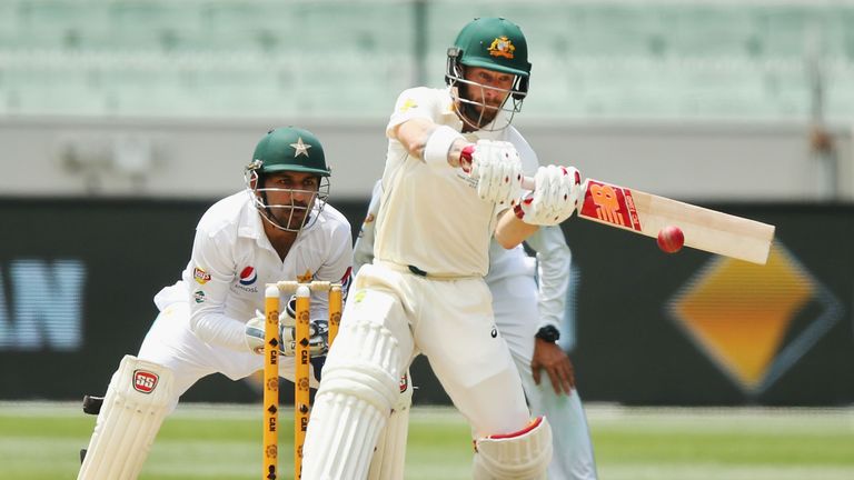 MELBOURNE, AUSTRALIA - DECEMBER 29:  Matthew Wade of Australia hits the ball into Azhar Ali of Pakistan during day four of the Second Test match between Au