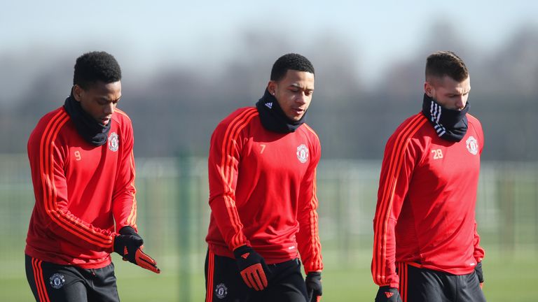 MANCHESTER, ENGLAND - FEBRUARY 24:  (L-R) Anthony Martial, Memphis Depay and Morgan Schneiderlin look on during a Manchester United training session ahead 