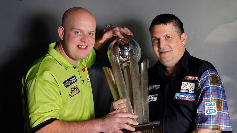 Michael van Gerwen with defending champion Gary Anderson (Picture: Lawrence Lustig)