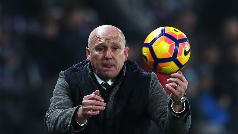 HULL, ENGLAND - DECEMBER 30:  Mike Phelan, Manager of Hull City throws the ball back during the Premier League match between Hull City and Everton at KCOM 