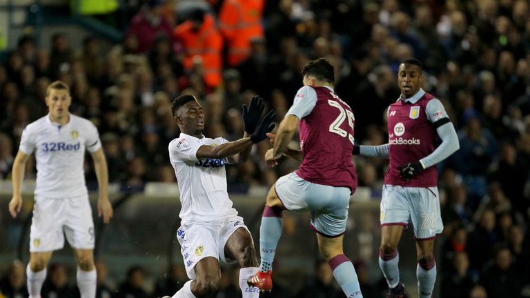 Aston Villa's Mile Jedinak challenges Leeds United's Hadi Sacko