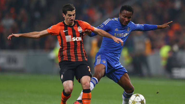 Mkhitaryan (L) of Shakhtar Donetsk challenges John Obi Mikel (R) of Chelsea