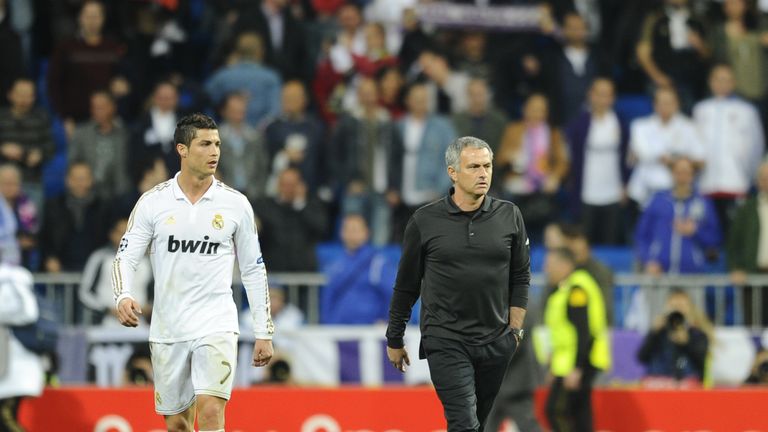 Real Madrid's Portuguese coach Jose Mourinho (R) walks with Real Madrid's Portuguese forward Cristiano Ronaldo 