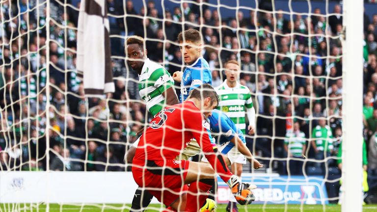 Celtic striker Moussa Dembele (L) scores against Rangers at Hampden in the last game between the teams