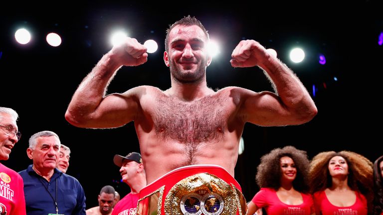 Murat Gassiev celebrates with the belt after winning by TKO against Felix Cora, Jr.