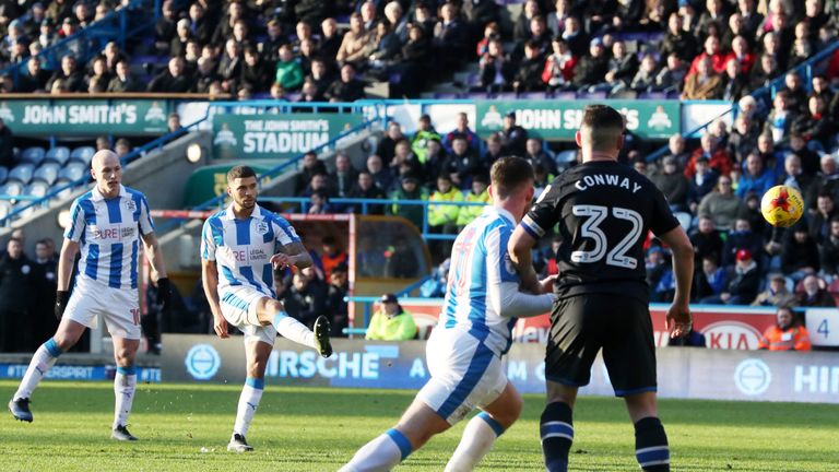 Nahki Wells curled home in stoppage-time to earn Huddersfield a point