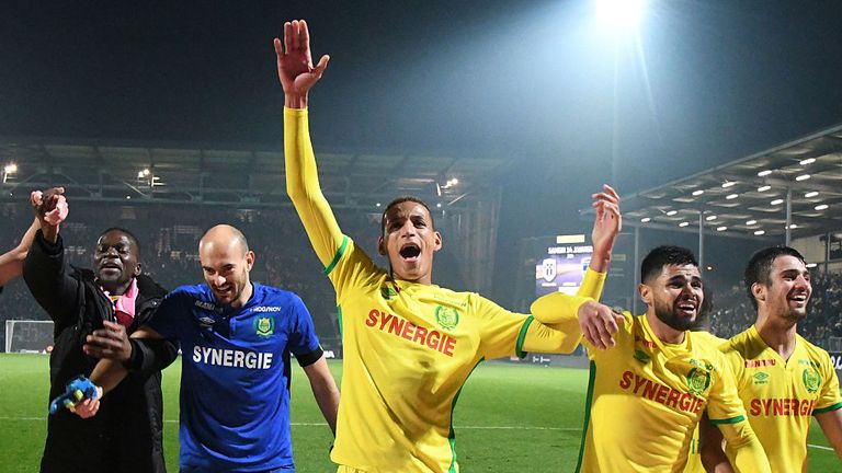 Nantes' players celebrate at the end of the French L1 football match between Angers and Nantes at the Jean Bouin Stadium in Angers,